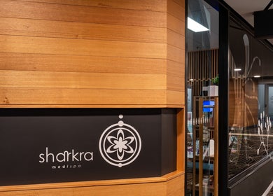 Entrance of Sharkra Medi Spa & Laser Clinic in Hobart, Tasmania, featuring modern decor and signage.