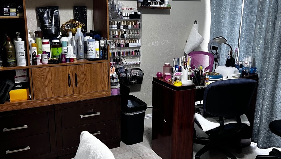 Beauty station at Dayami Glam, Miami, Florida, US with nail polish and hair products showcasing elegance.