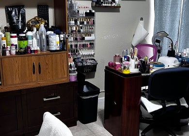 Beauty station at Dayami Glam, Miami, Florida, US with nail polish and hair products showcasing elegance.