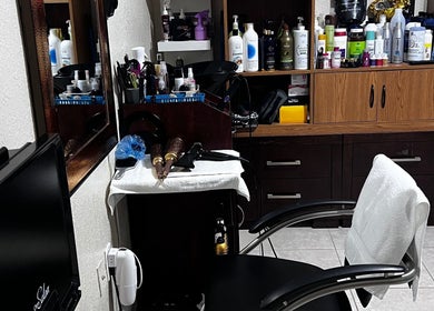 Stylish station at Dayami Glam, Miami, Florida, US with a sleek chair and beauty products on display.