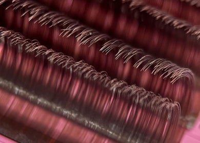 Close-up of quality eyelash extensions at Glam Lashes NYC, New York, New York, US, showcasing fine lash curls.