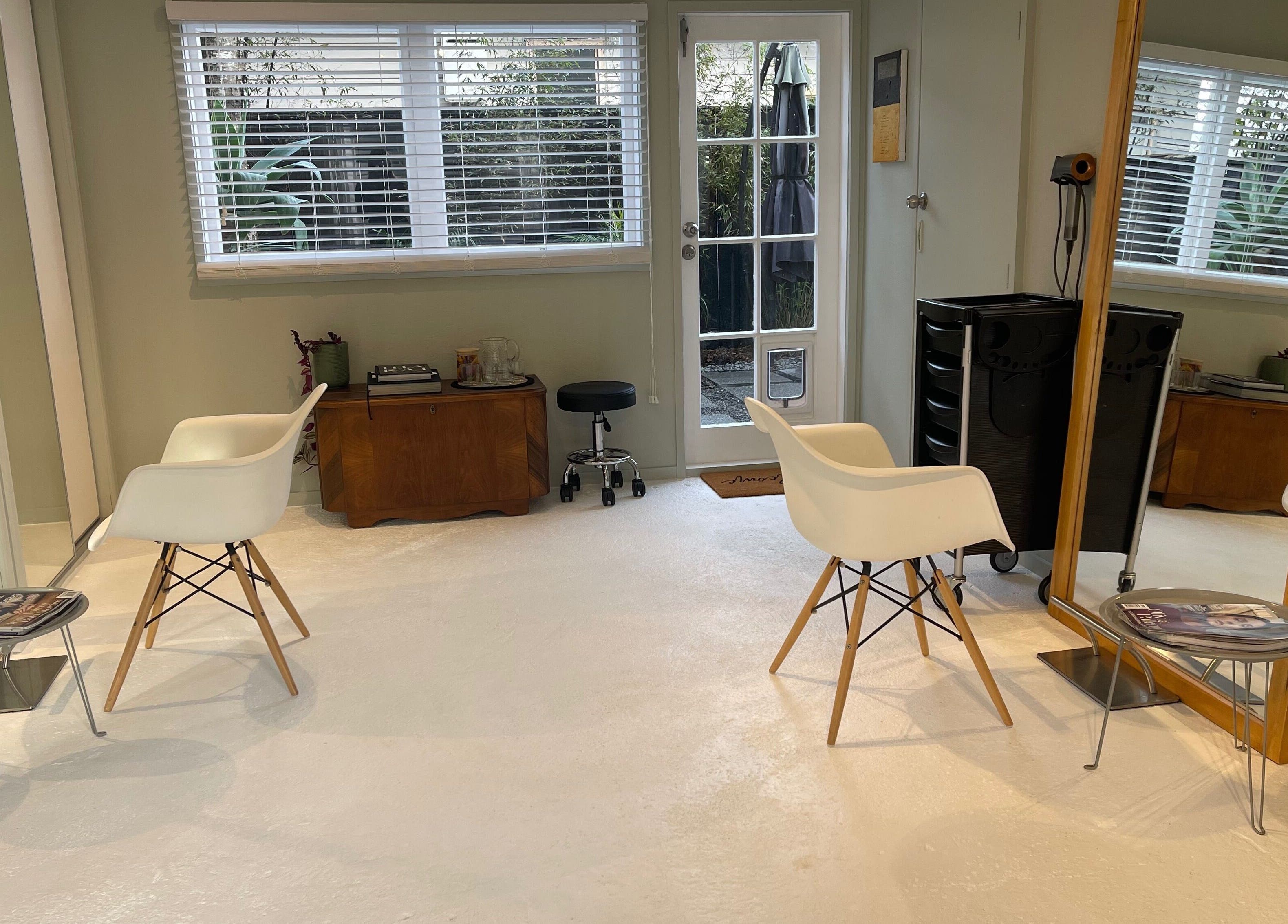 Stylish interior of The Studio in Paraparaumu Beach, Wellington Region, NZ with sleek chairs and decor.