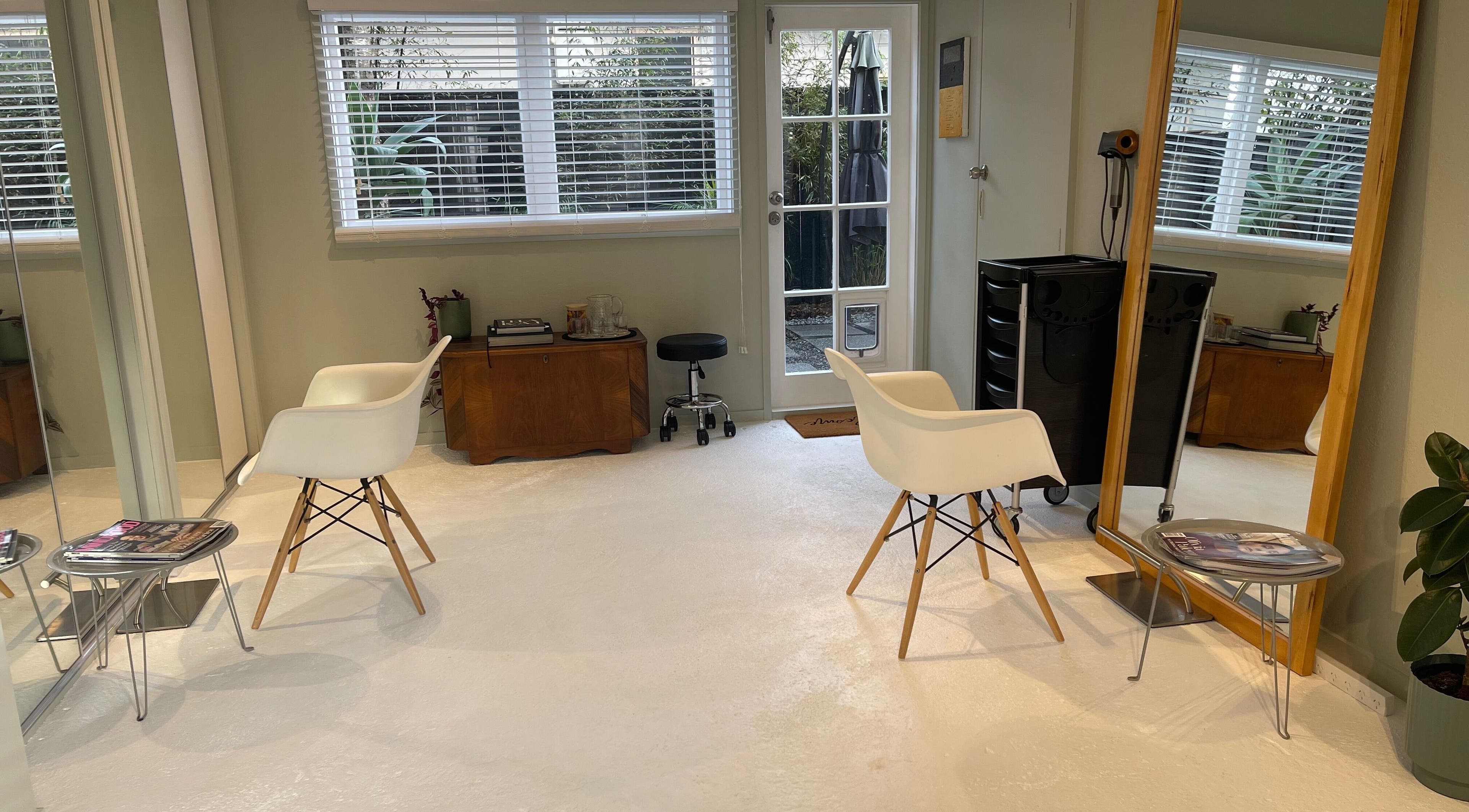 Stylish interior of The Studio in Paraparaumu Beach, Wellington Region, NZ with sleek chairs and decor.