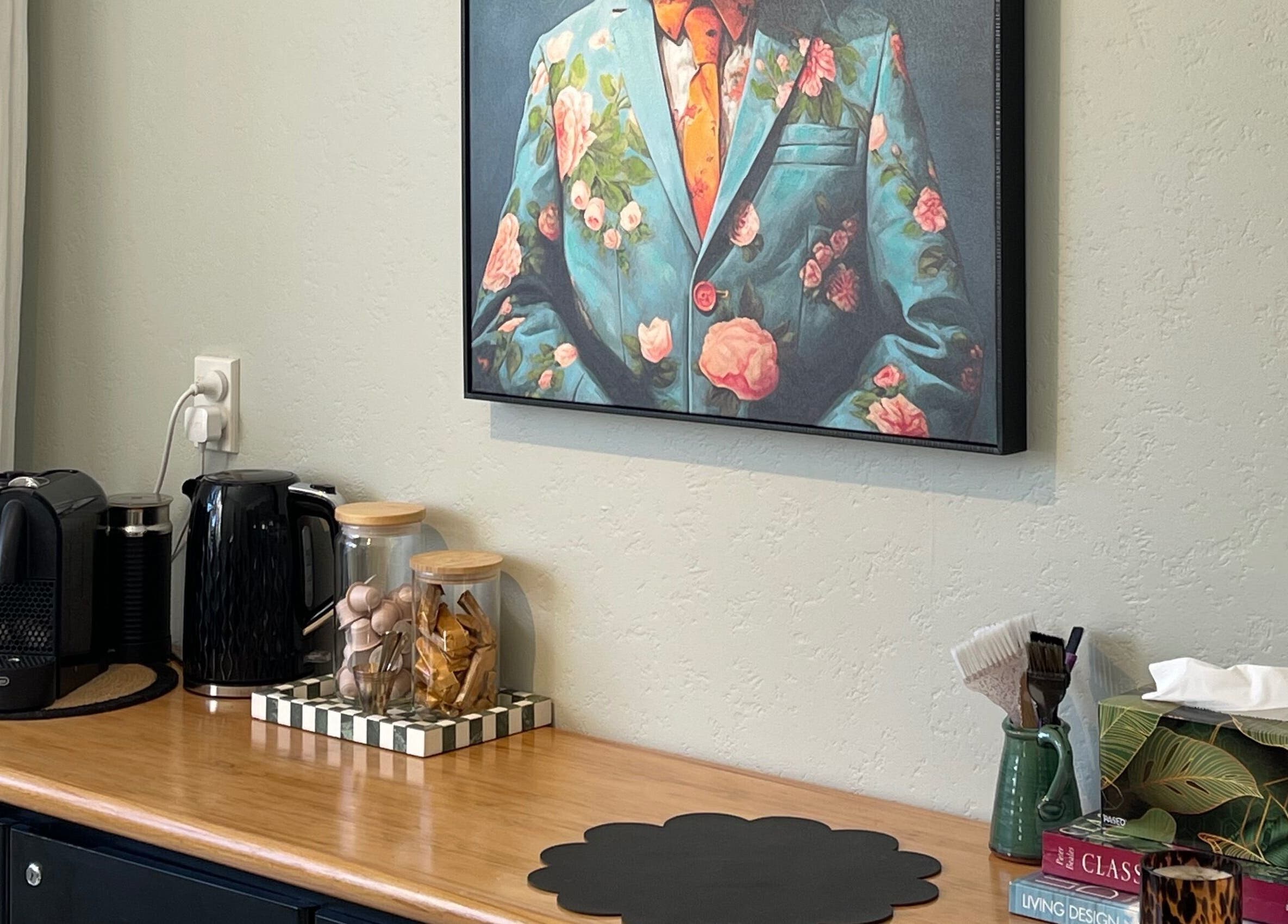 Artistic nook at The Studio, Paraparaumu Beach, Wellington Region, NZ with painting and coffee setup.