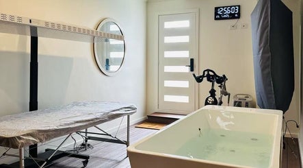Serene wellness room at SHUGENDŌ RECHARGE STUDIO in Cape Paterson, Victoria, AU with hydrotherapy bath and equipment.