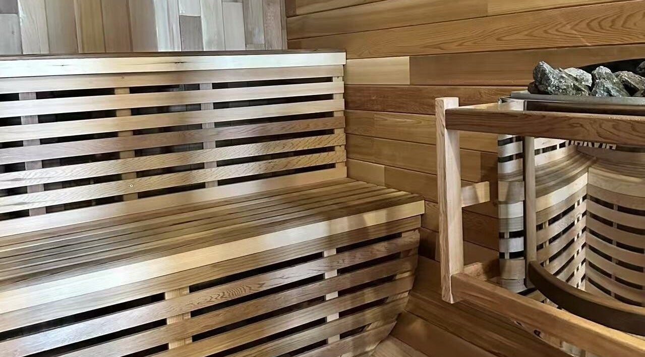 Wooden sauna interior at SHUGENDŌ RECHARGE STUDIO, Cape Paterson, Victoria, AU, offering relaxation and wellness.