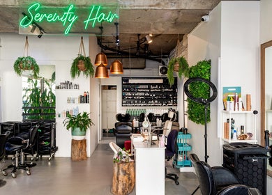 Chic interior of Serenity Hair & Co in Surry Hills, New South Wales, showcasing modern decor and styling stations.