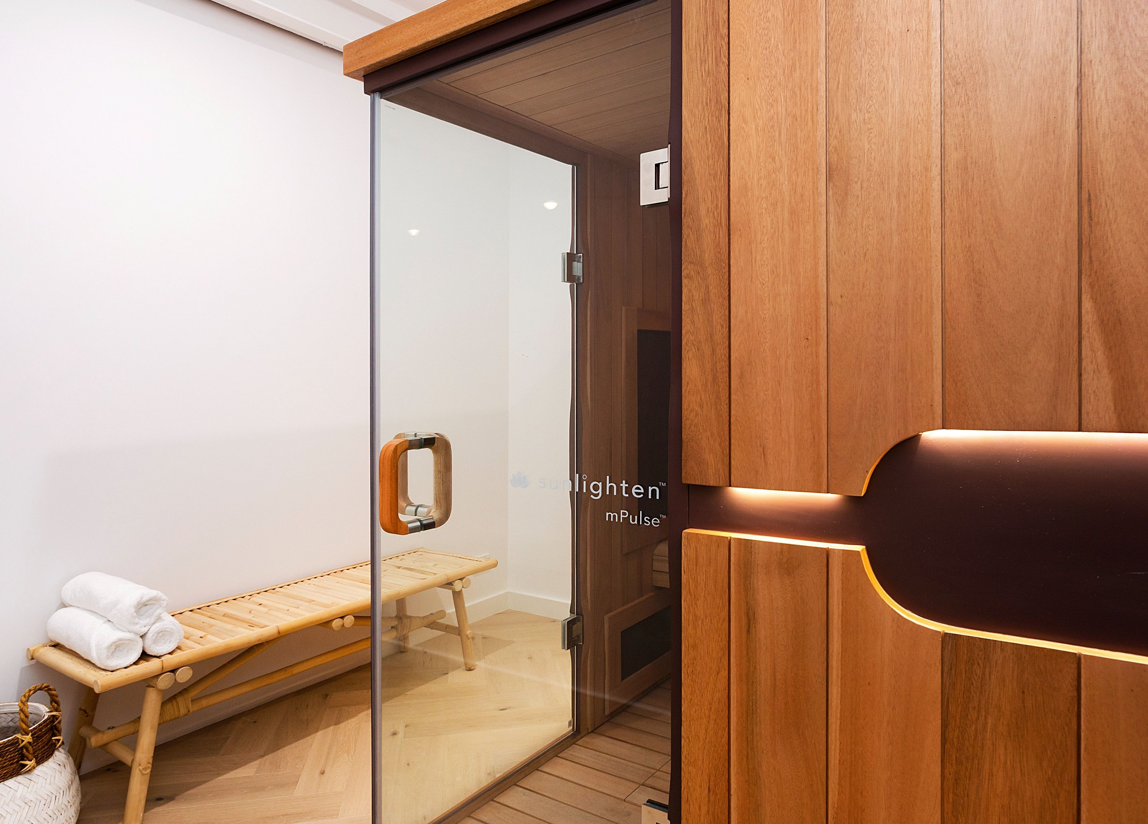 Luxurious sauna room at La Cure, Caringbah South, New South Wales, AU with wooden interior and seating.