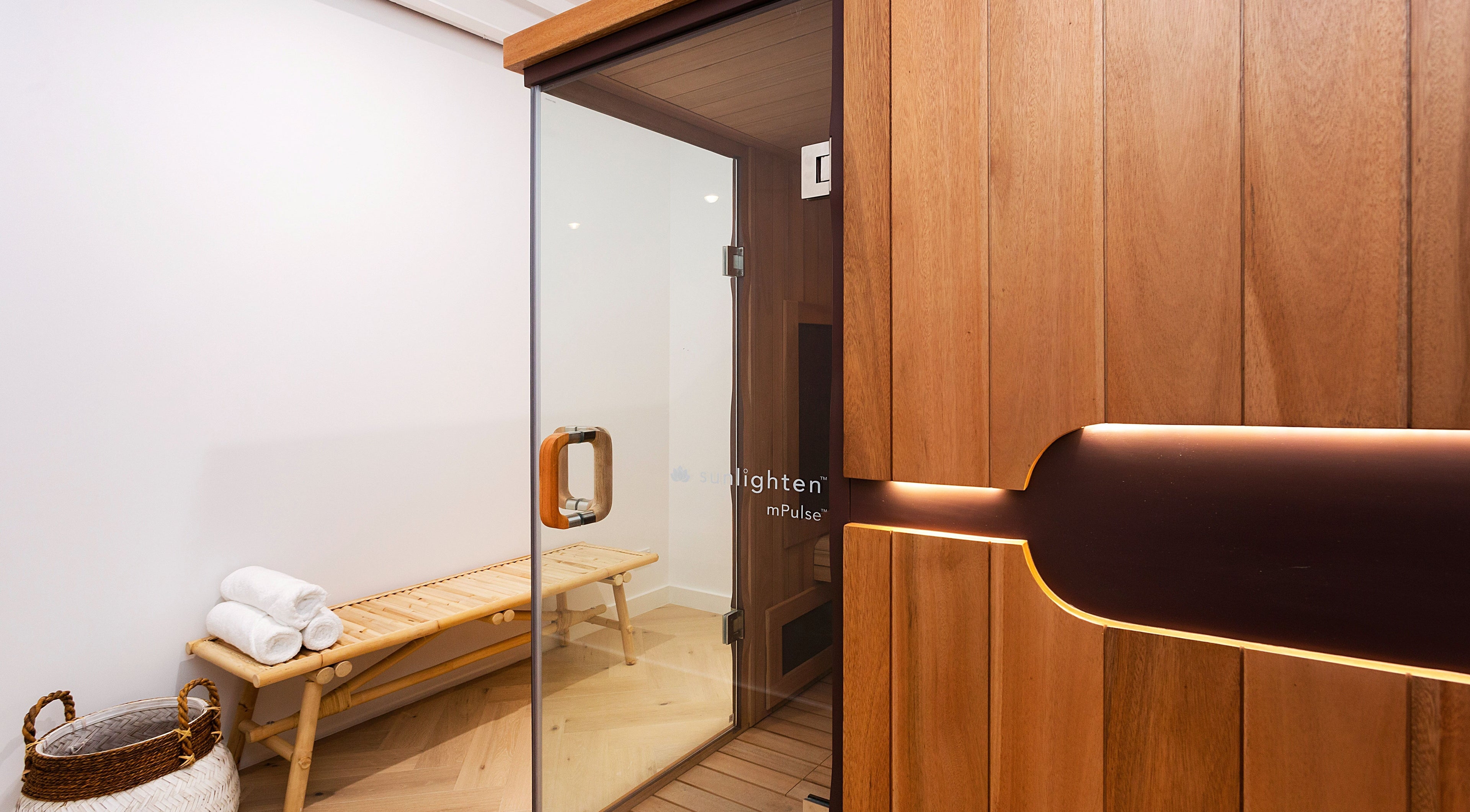 Luxurious sauna room at La Cure, Caringbah South, New South Wales, AU with wooden interior and seating.