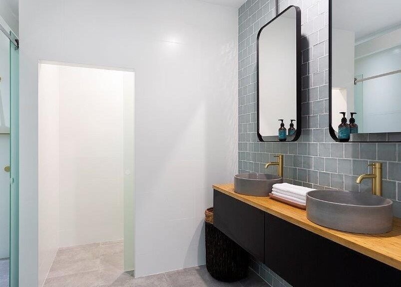 Luxurious bathroom at La Cure, Caringbah South, New South Wales, AU, featuring modern sinks and chic design.