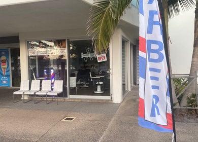 Exterior of The Cutler Barbershop Currimundi with chairs and barber flag in Currimundi, Queensland, AU.