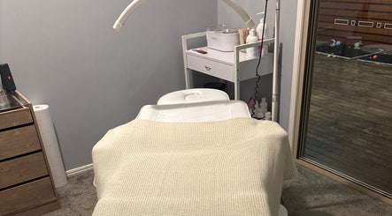 Cozy treatment room at Beauty Lounge By Lil, Meringandan, Queensland, AU featuring a comfortable massage bed.