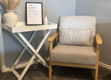 Relaxing corner at Beauty Lounge By Lil, Meringandan, Queensland, AU with a chair, pillow, and decor.