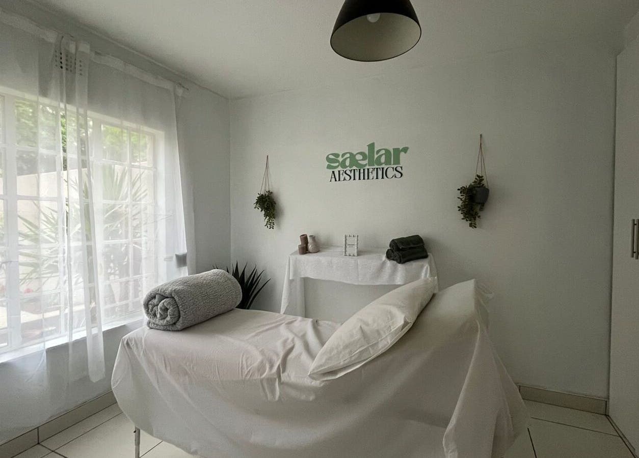 Treatment room at Sælar Aesthetics in Edenvale, Gauteng, ZA, featuring a tranquil setup with natural light.