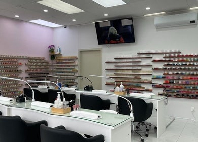 Modern nail bar at Nails Are Us Pakuranga, Auckland, NZ with vibrant polish displays.