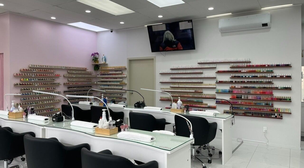 Modern nail bar at Nails Are Us Pakuranga, Auckland, NZ with vibrant polish displays.