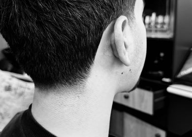 Close-up of a fresh haircut at The Meister Barber in Jabal Lubnan, Jabal Lubnan, LB showcasing precise styling.