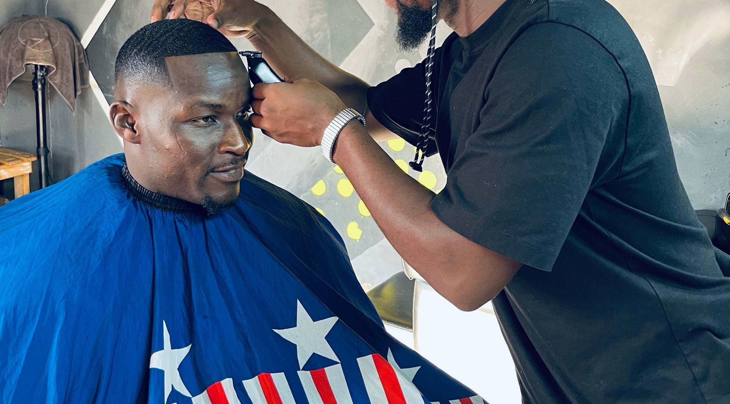 Barber expertly styling at Mapopotane Barbershop, Roodepoort, Gauteng, ZA