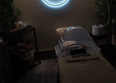 Tranquil treatment room at Aurora Japanese Head Spa, Killough, Northern Ireland, GB with massage table and decor.