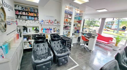 Relaxing salon space with hair product displays at CC Hair Studio, Oxford, England, GB.