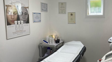 Cozy treatment room at CC Hair Studio, Oxford, England, GB with skincare products and certificates displayed.