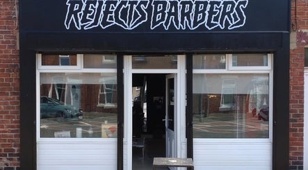 Front entrance of Rejects Barbers in Boldon Colliery, England, GB, featuring modern signage and elegant decor.