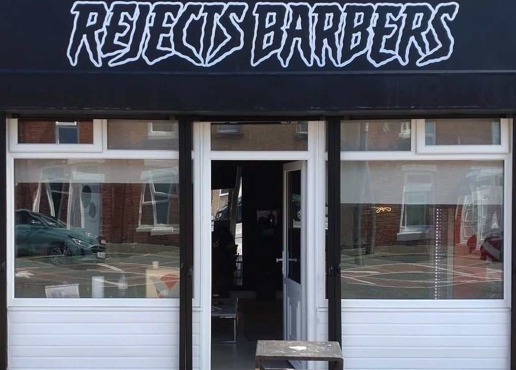 Front view of Rejects Barbers in Boldon Colliery, England, showcasing its modern aesthetic entrance.