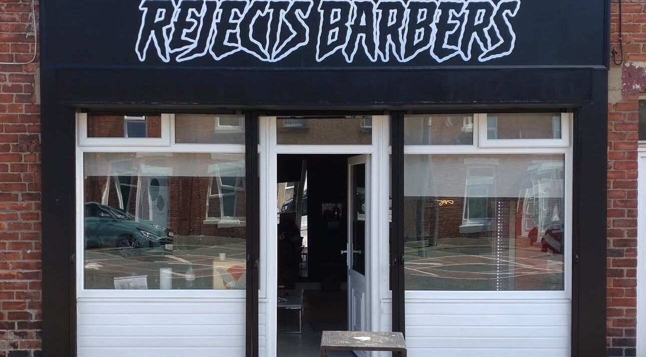 Front view of Rejects Barbers in Boldon Colliery, England, showcasing its modern aesthetic entrance.