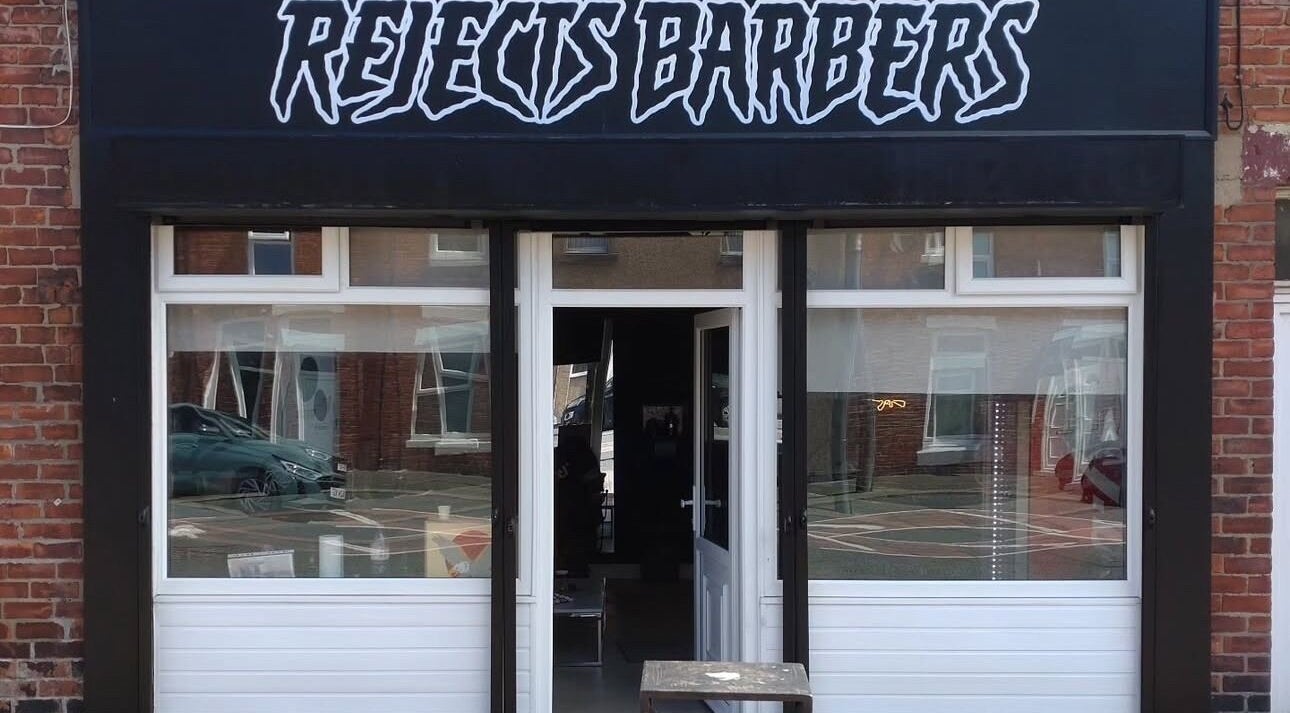 Front view of Rejects Barbers in Boldon Colliery, England, showcasing its modern aesthetic entrance.