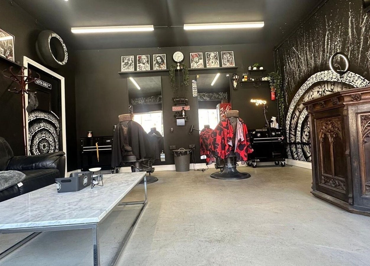 Modern interior of Rejects Barbers in Boldon Colliery, England, showcasing stylish decor and barber chairs.