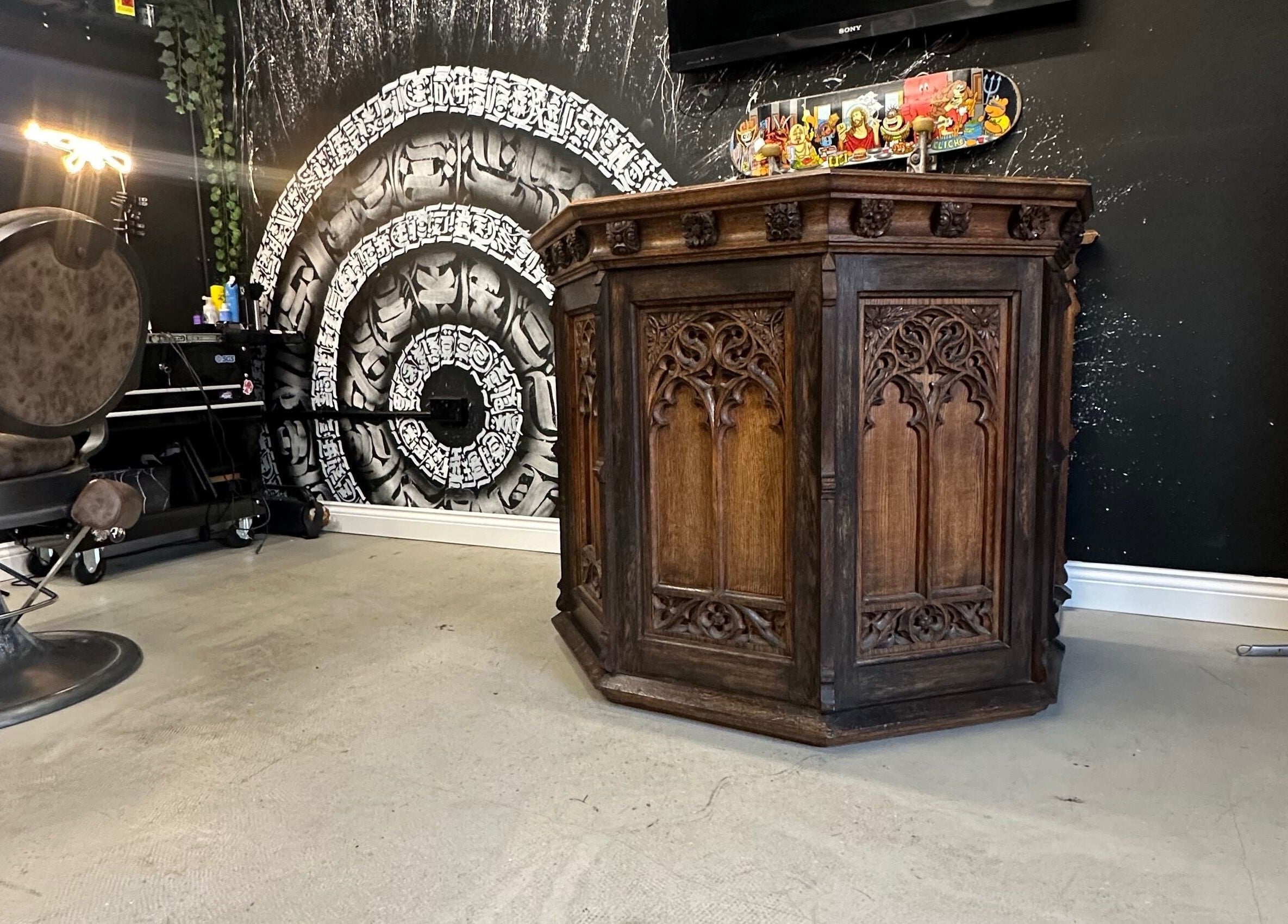 Unique Gothic decor and barber chair at Rejects Barbers, Boldon Colliery, England, GB. Stylish and welcoming atmosphere.