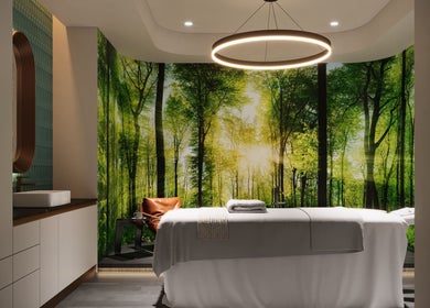 LUXEGLO MEDICAL AESTHETICS massage room with forest wallpaper in Perth, Western Australia, AU.