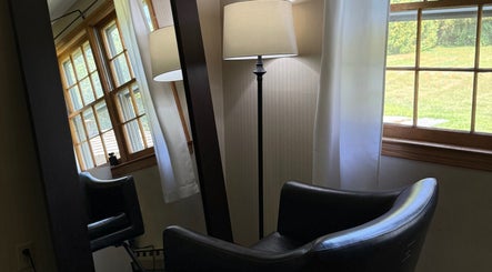 Elegant seating area with natural light at Flor & Fita, Ellington, Connecticut, US.