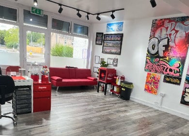 Bright, artistic interior of Concepts Tattoo Limited in Swindon, England, GB with vibrant graffiti on the walls.