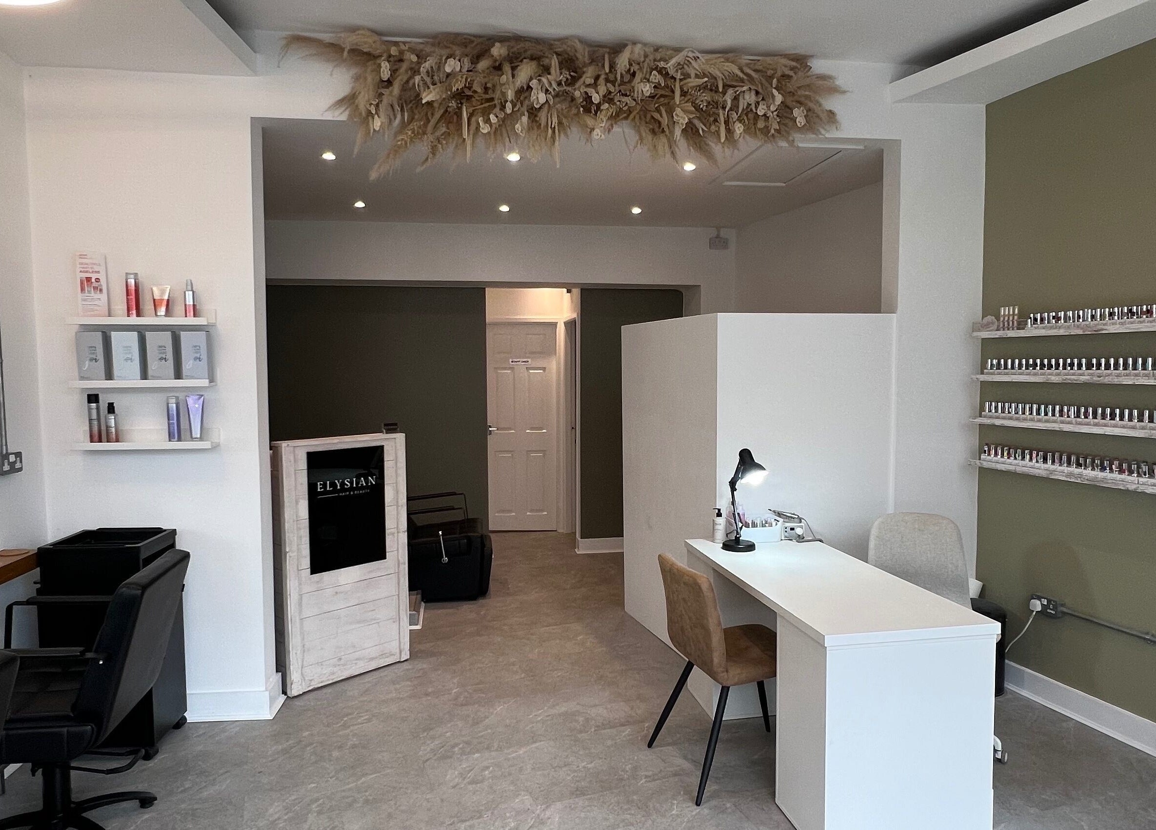 Elysian Hair & Beauty salon interior showing styling stations and product displays in Brighouse, England, GB.