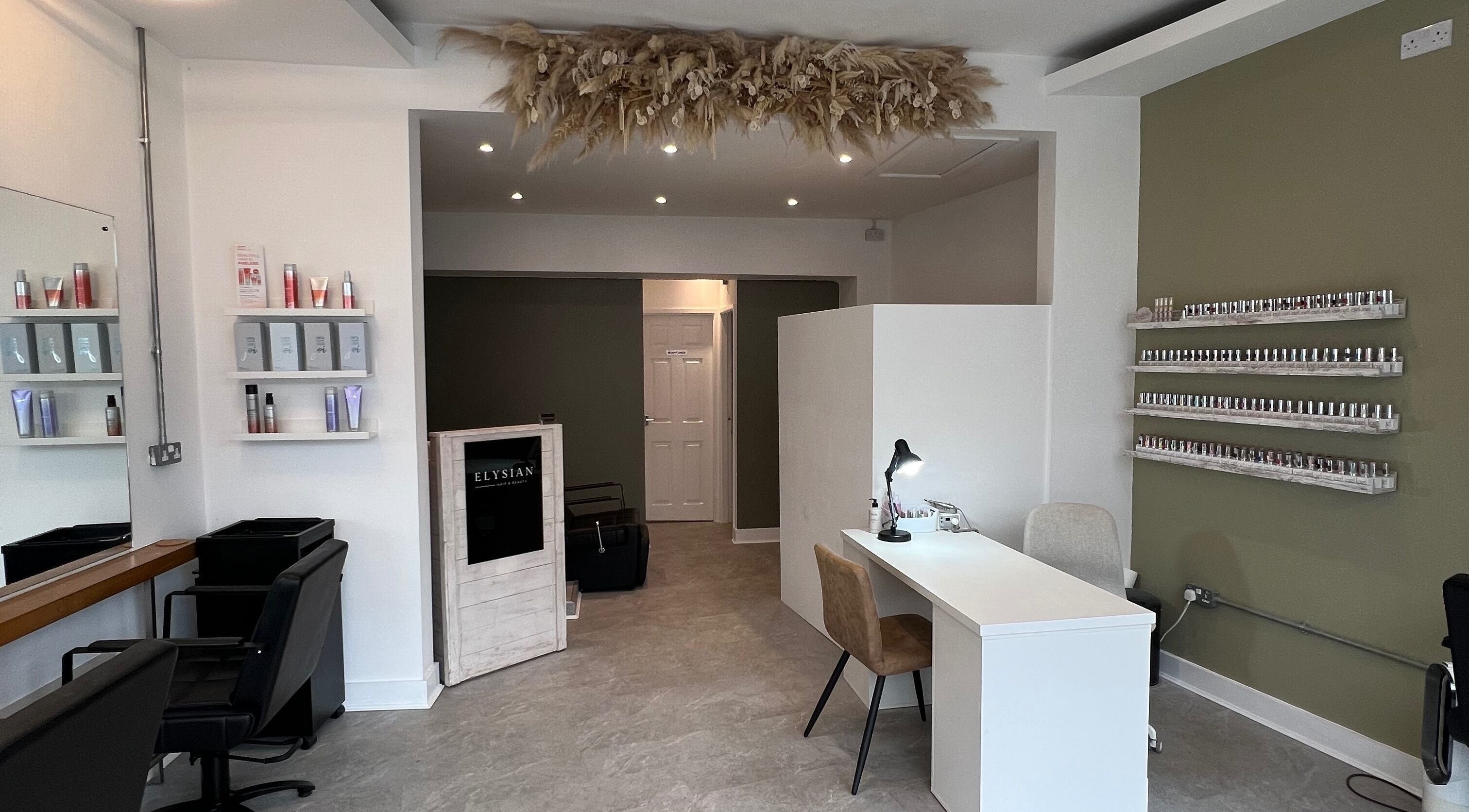 Elysian Hair & Beauty salon interior showing styling stations and product displays in Brighouse, England, GB.