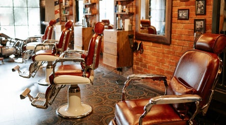 Vintage barber chairs at Goodfellas Barber & Brand | Est. 2018, Vagator, Goa, IN with a classic decor.