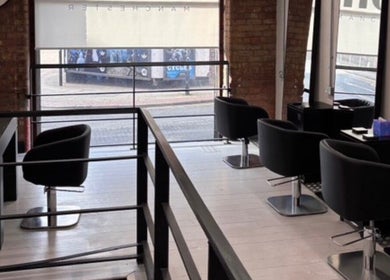 Chic modern interior of Olivermarshair in Manchester, England, GB with sleek design and comfortable seating.