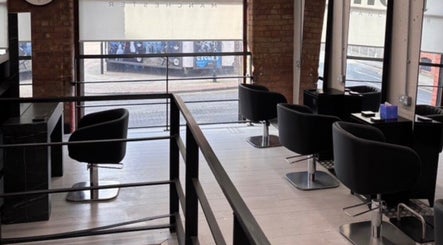 Chic modern interior of Olivermarshair in Manchester, England, GB with sleek design and comfortable seating.