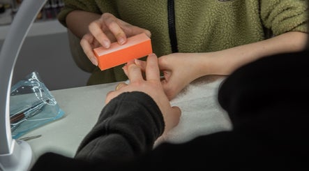 Nail buffing service at Pick Your Color Nail Salon in Chicago, IL, US, enhancing nail polish adherence.
