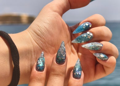 Stunning ocean-inspired nail art with blue hues at Kyuote_Nails, Rīga, LV.