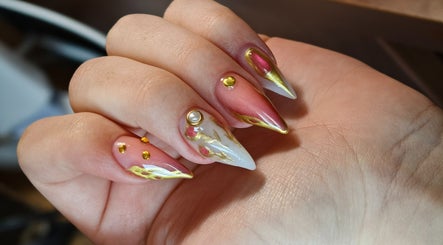 Stunning nail art with gems at Kyuote_Nails, Rīga, LV showcases elegant design and precision.