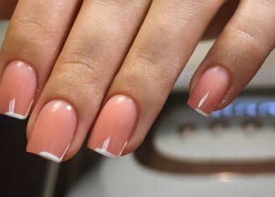 Elegant pink manicure at Kyuote_Nails in Rīga, LV, showcasing detailed nail artistry.