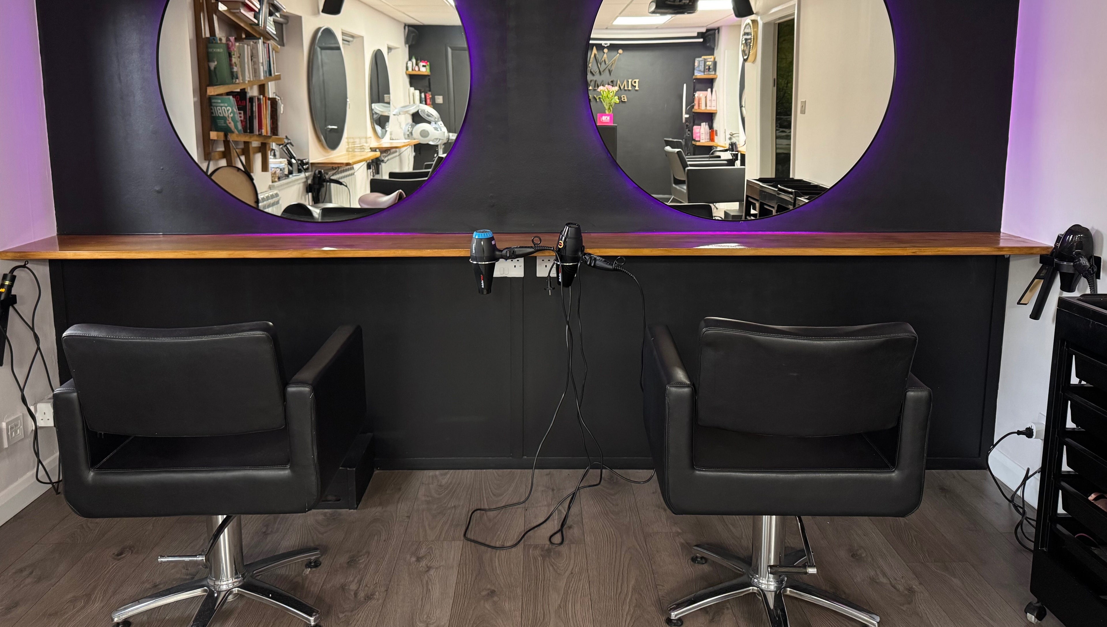 Modern salon chairs and elegant mirrors at Pimp My Hair, Aberdeen, Scotland, GB.