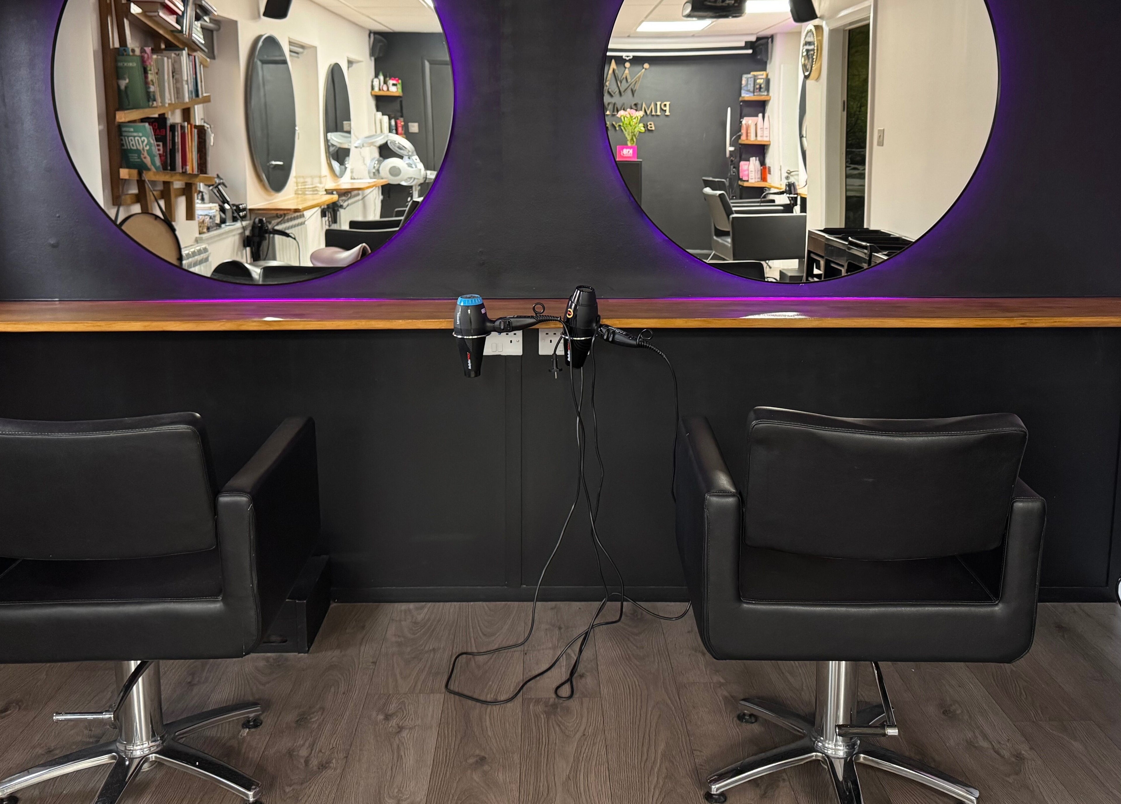 Modern salon chairs and elegant mirrors at Pimp My Hair, Aberdeen, Scotland, GB.