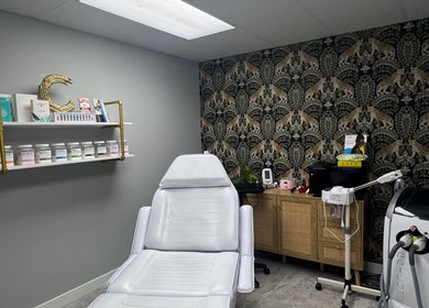 Spa room at Lueur Luxury Esthetics, Naicam, Saskatchewan, CA with treatment chair and elegant decor.