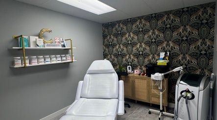 Spa room at Lueur Luxury Esthetics, Naicam, Saskatchewan, CA with treatment chair and elegant decor.