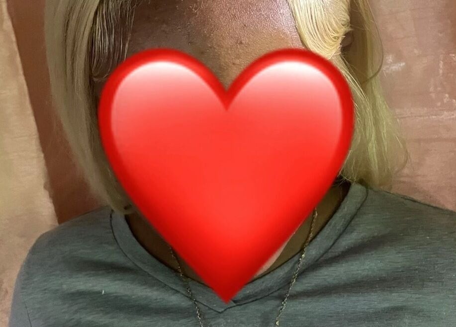 Blonde hairstyle showcased at Glam and Vibe Studio, Mahaica, Demerara-mahaica, GY with elegant curtain backdrop.