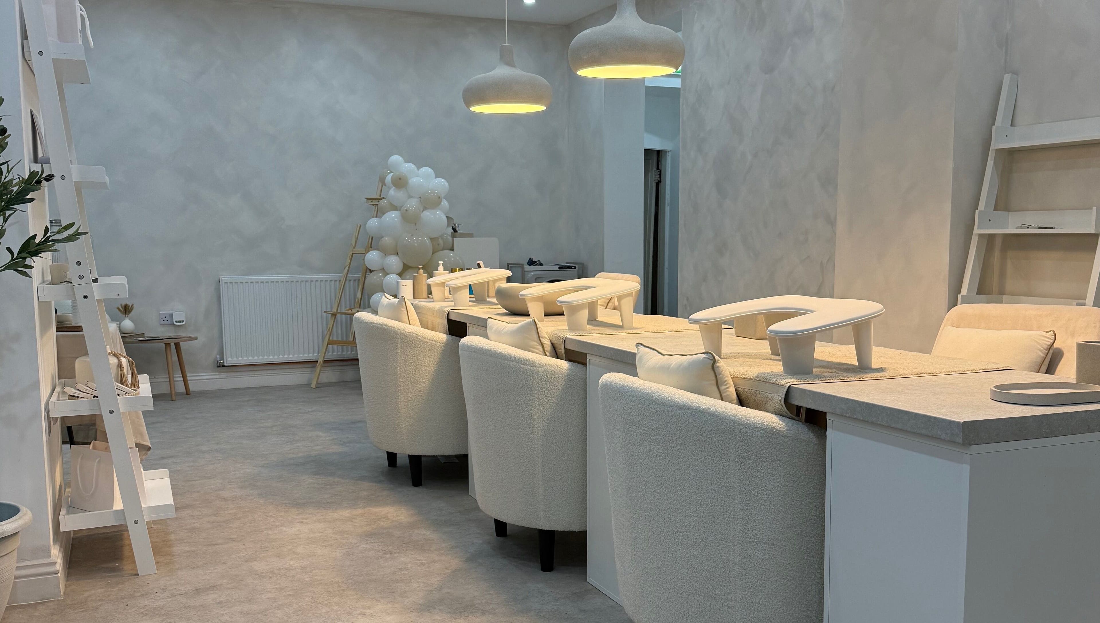 Modern beauty lounge area at Louise Butler Beauty, Kidsgrove, England, GB, with chic decor and soft lighting.