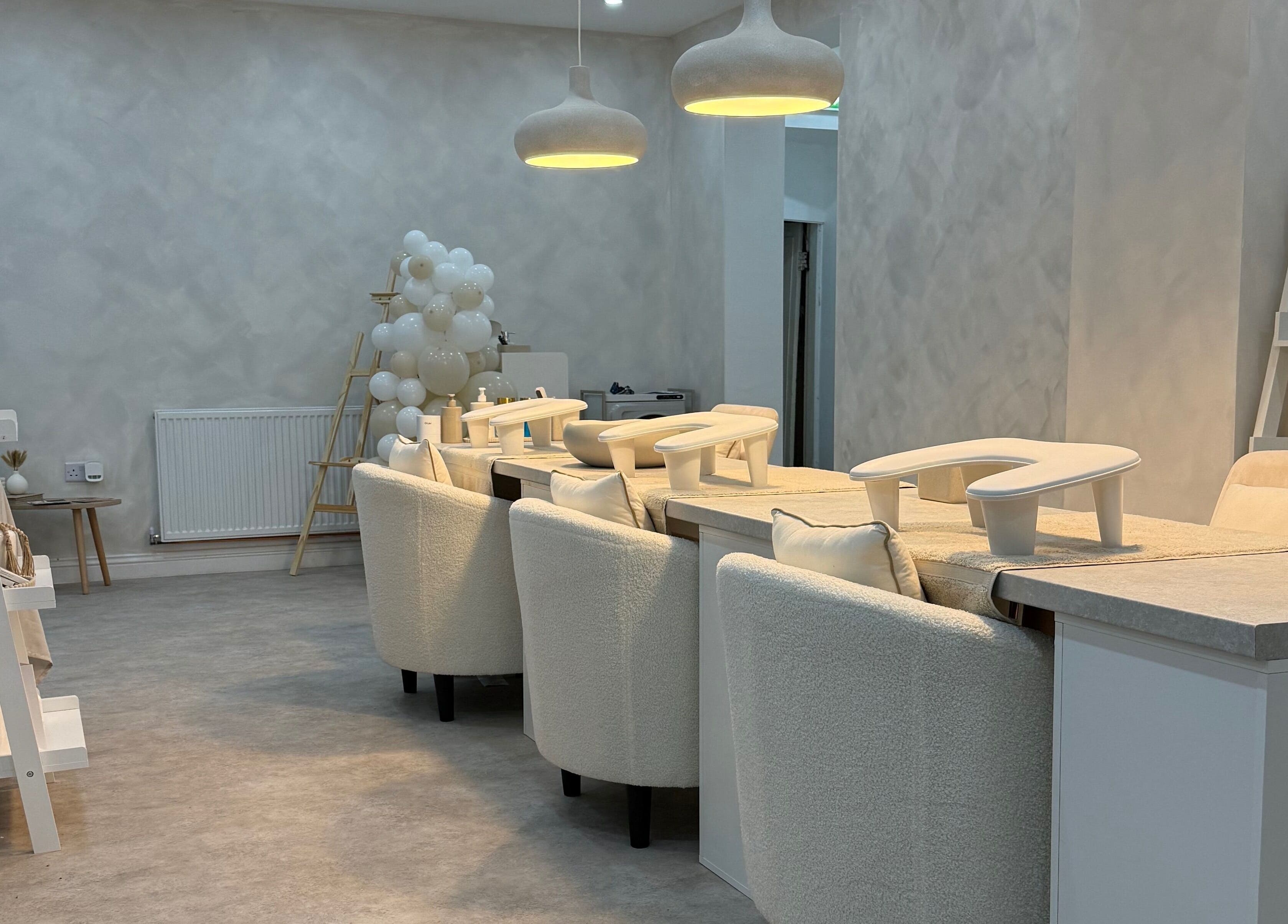 Modern beauty lounge area at Louise Butler Beauty, Kidsgrove, England, GB, with chic decor and soft lighting.